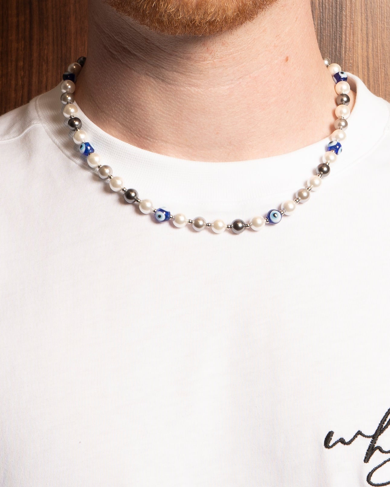 Pearl necklace with blue eye